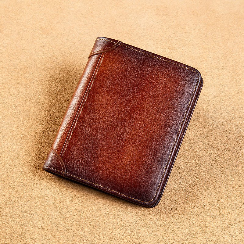 Brown leather wallet on a beige background