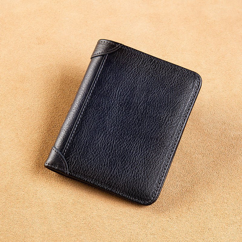 Black leather wallet on a beige background