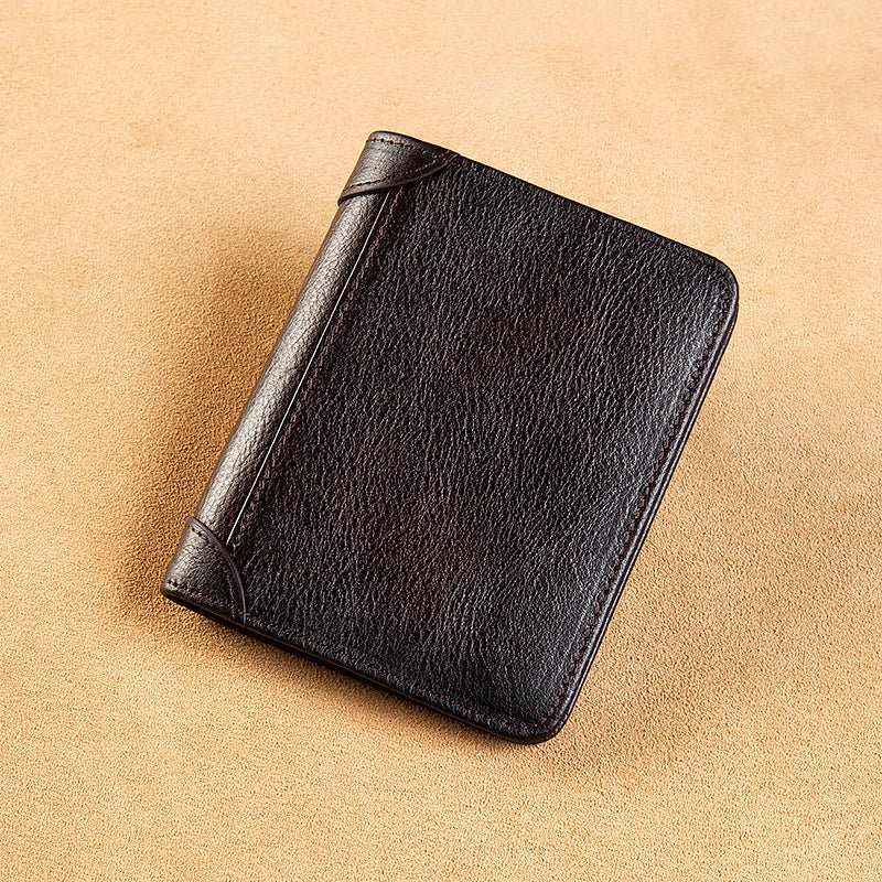 Black leather notebook on a beige background
