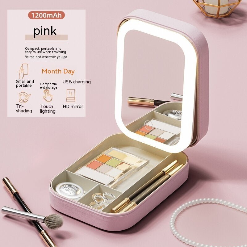 Pink makeup set with LED mirror on a pink background