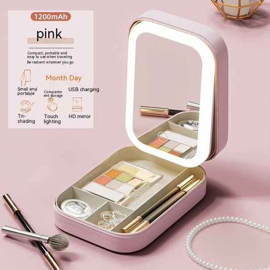 Pink makeup set with LED mirror on a pink background